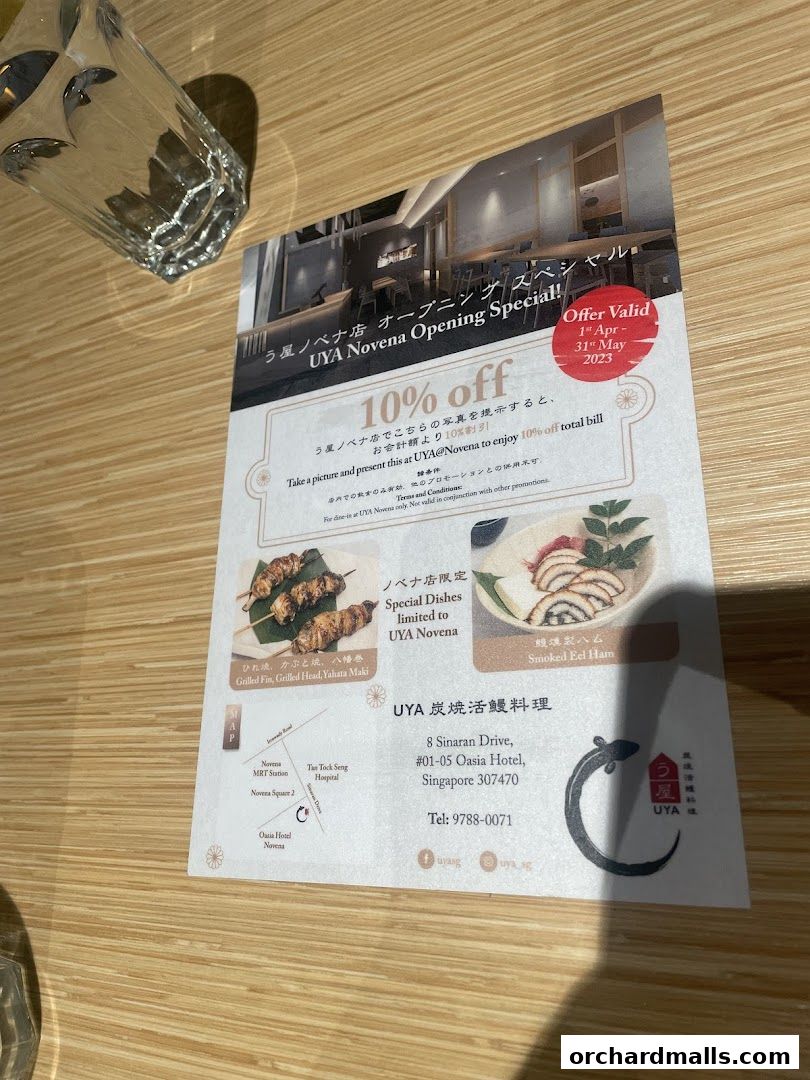 A flyer for UYA Novena's opening special offering 10% off with images of grilled skewers and smoked eel.