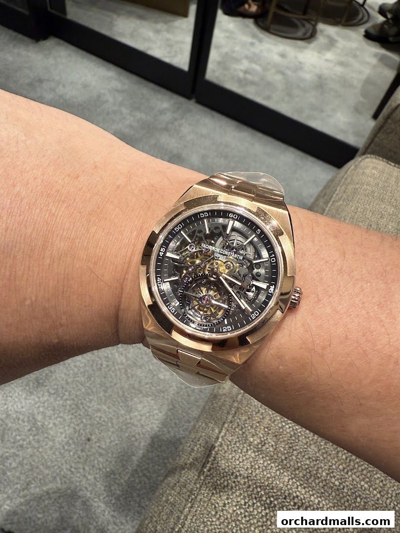 A person wearing a Vacheron Constantin rose gold skeleton watch on their wrist.