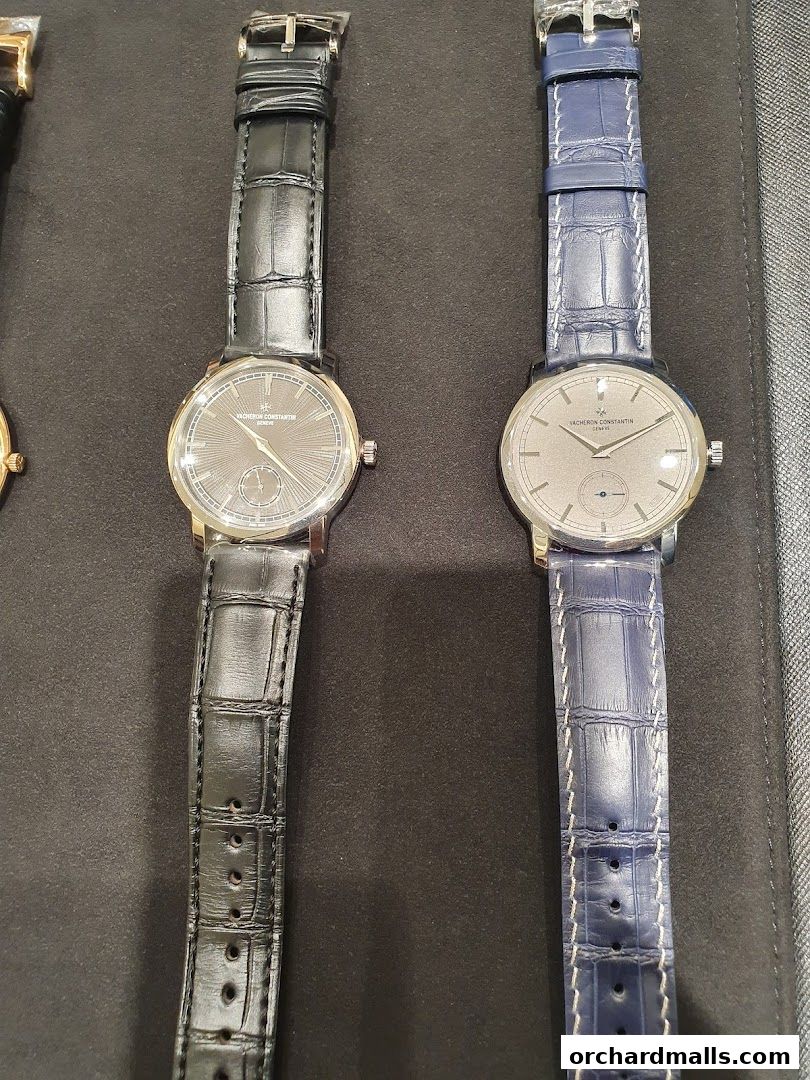 Two Vacheron Constantin watches with black and blue alligator straps displayed.