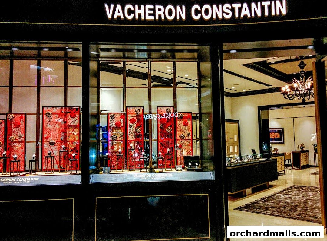 The elegant storefront of Vacheron Constantin, showcasing luxury watches in a beautifully decorated window display.