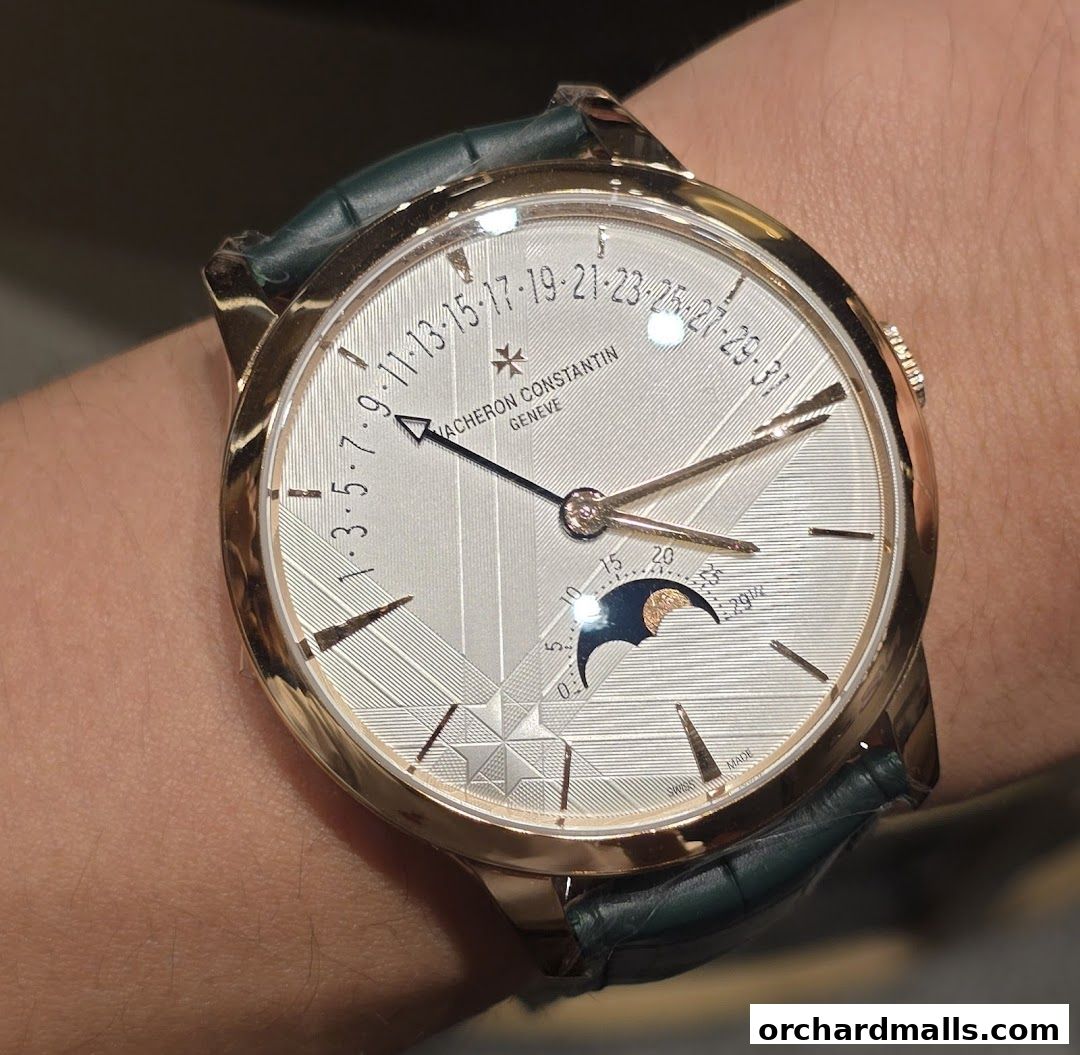 A close-up shot of a Vacheron Constantin watch with a moon phase complication on a person's wrist.