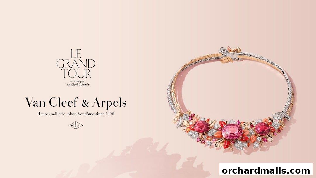 A stunning Van Cleef & Arpels necklace with pink and red gemstones and diamond accents.