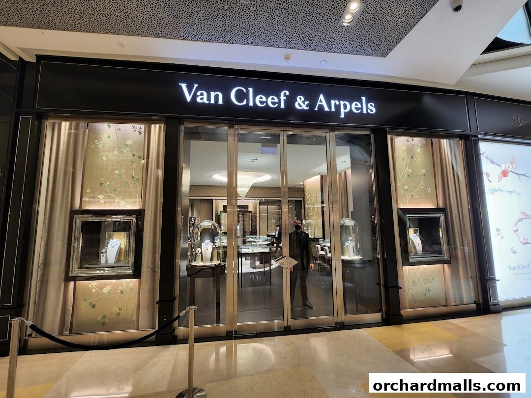 The elegant storefront of Van Cleef & Arpels at ION Orchard, showcasing exquisite jewelry displays.