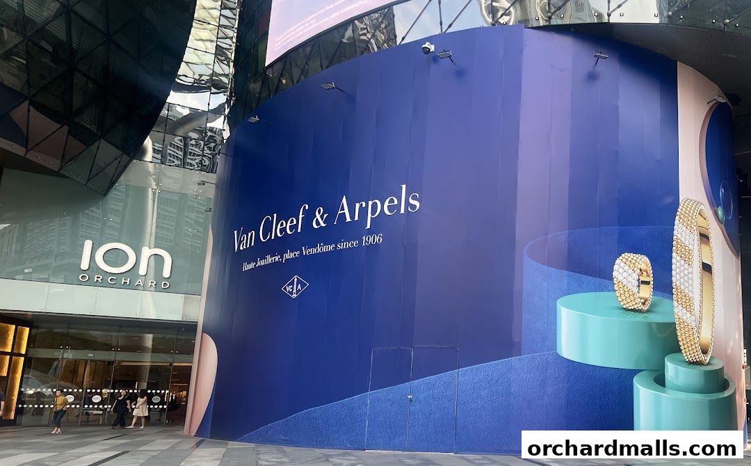 Van Cleef & Arpels storefront at ION Orchard, featuring jewelry displays and the brand's signature.