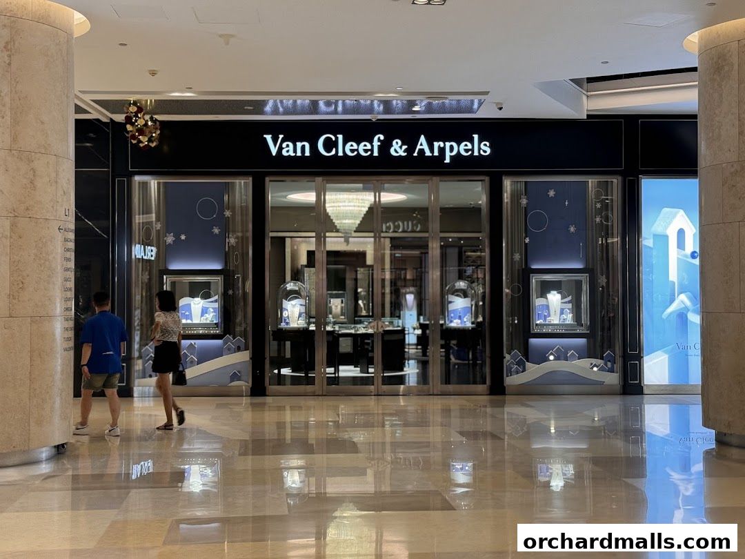 The elegant facade of Van Cleef & Arpels at ION Orchard, showcasing exquisite jewelry displays.