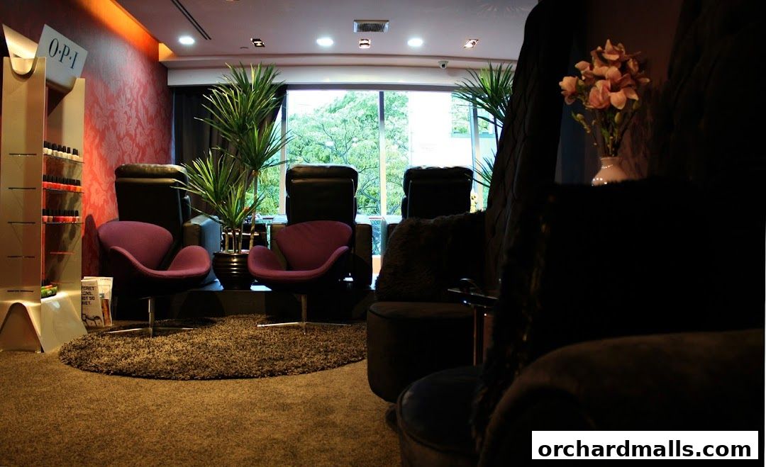 Interior of a medi-spa with pedicure chairs, nail polish display, and plants.