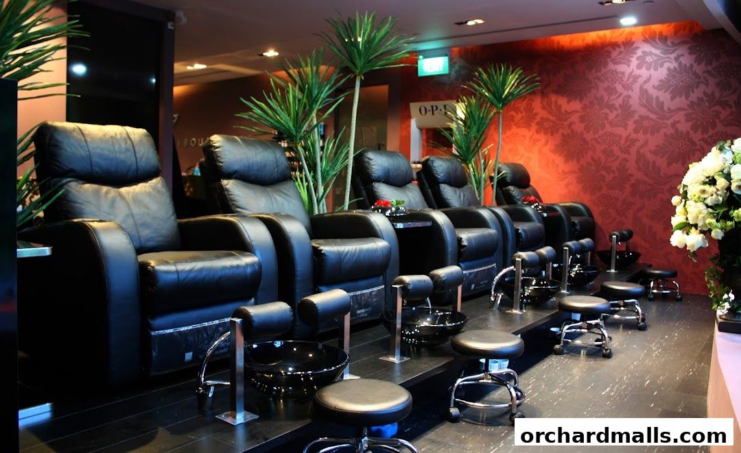 Luxurious spa interior with comfortable reclining chairs and pedicure stations.