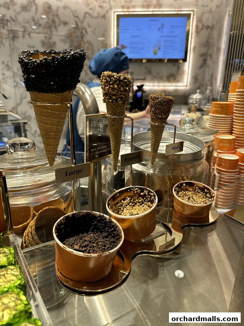 Venchi Singapore ION Orchard Store displays various chocolate-covered ice cream cones and cups.