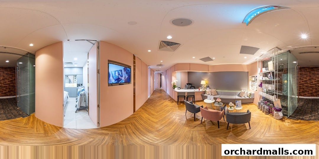 Interior view of a modern medical aesthetic clinic with a reception area and treatment rooms.