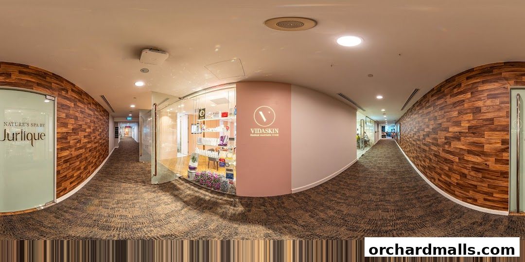 Exterior view of VIDASKIN Medical Aesthetic Clinic and Jurlique Spa in a modern hallway.