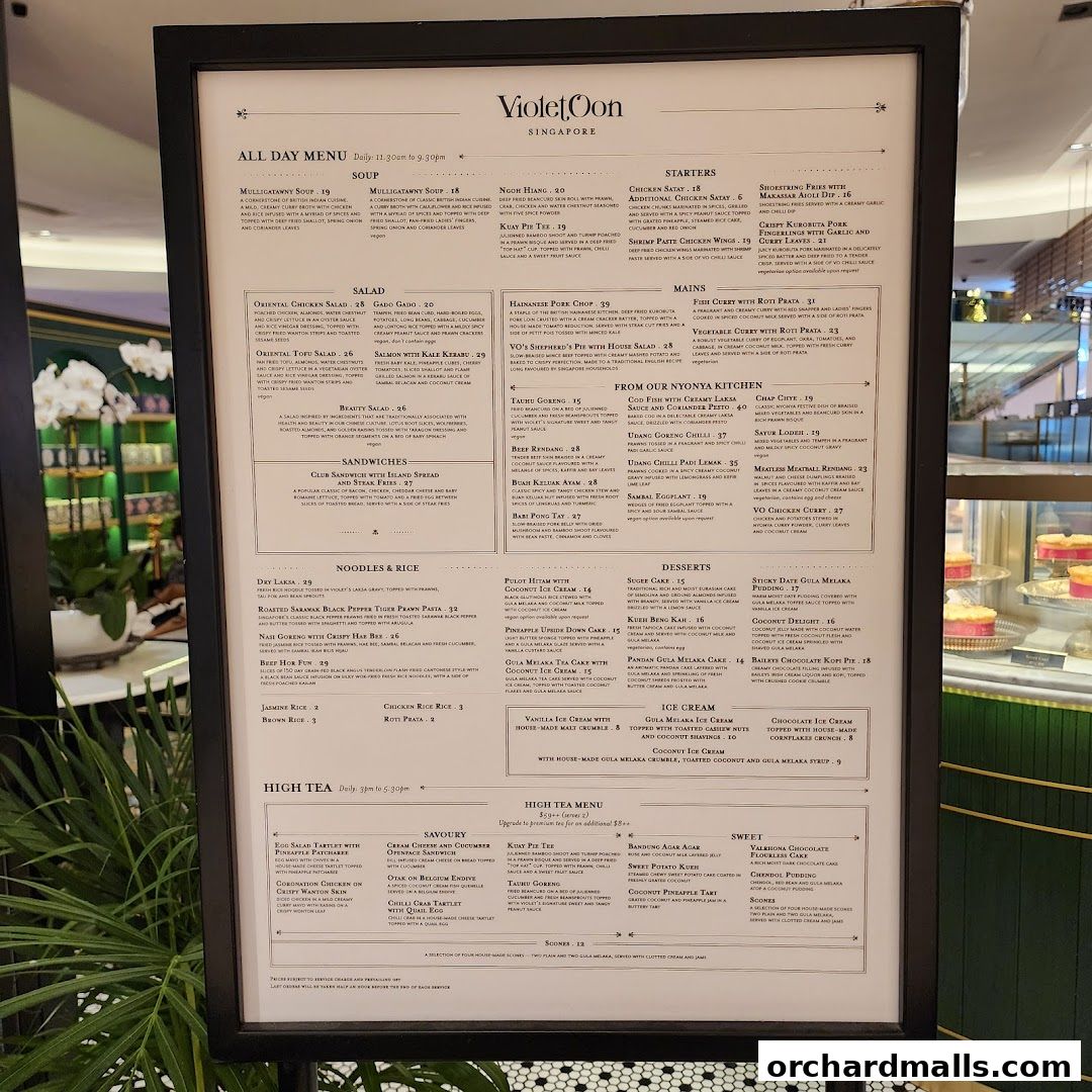 A menu from Violet Oon Singapore featuring a wide variety of dishes including soups, salads, mains, noodles, rice, desserts, and high tea.