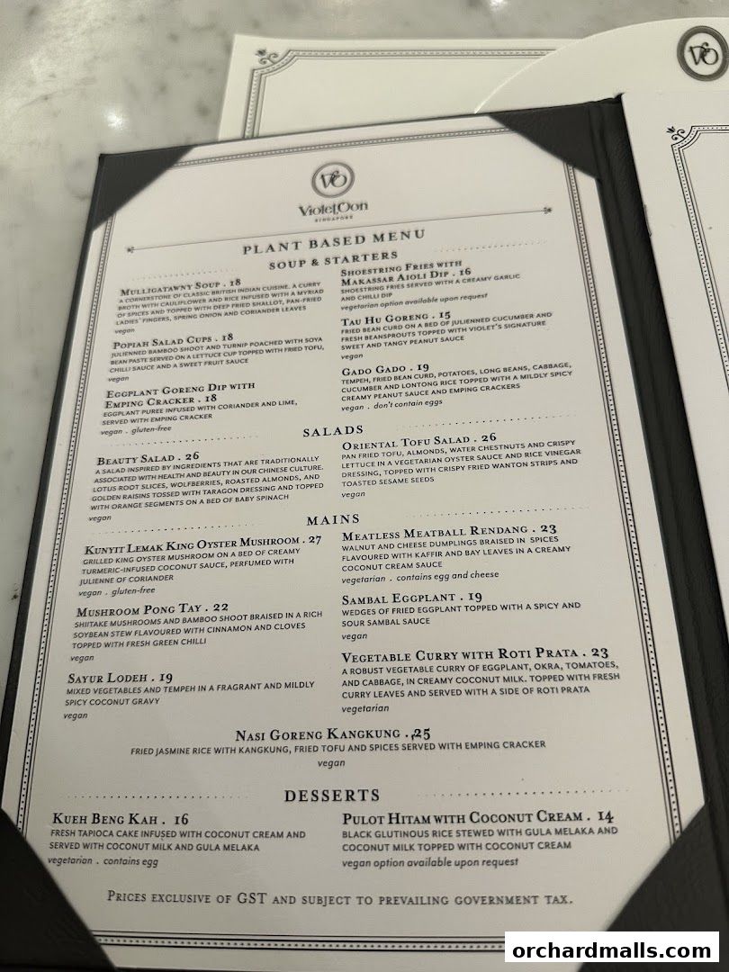 A plant-based menu from Violet Oon at ION Orchard, featuring soups, starters, mains, and desserts.