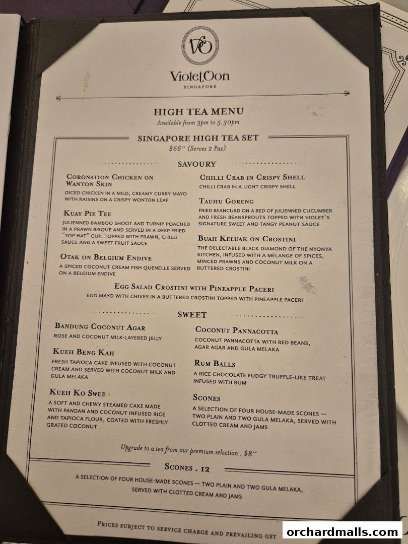 A menu for Violet Oon Singapore's High Tea Set, featuring savory and sweet items.