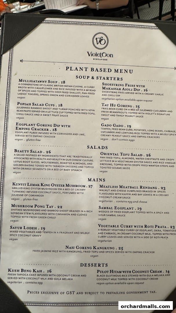 A plant-based menu from Violet Oon Singapore featuring soups, starters, salads, mains, and desserts.