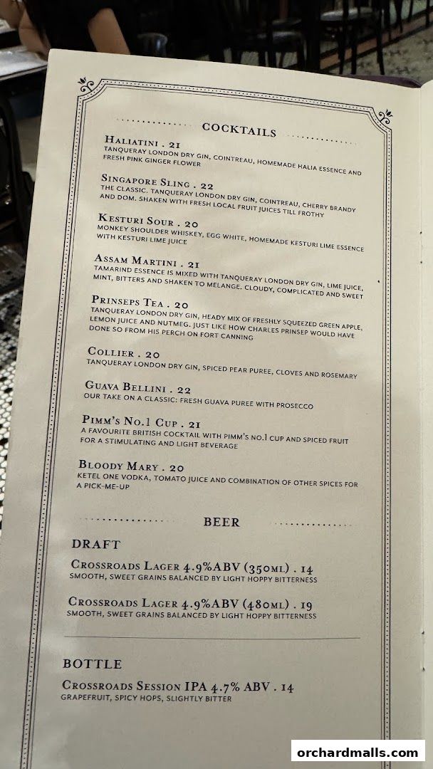 A menu featuring cocktails and beers with descriptions and prices.