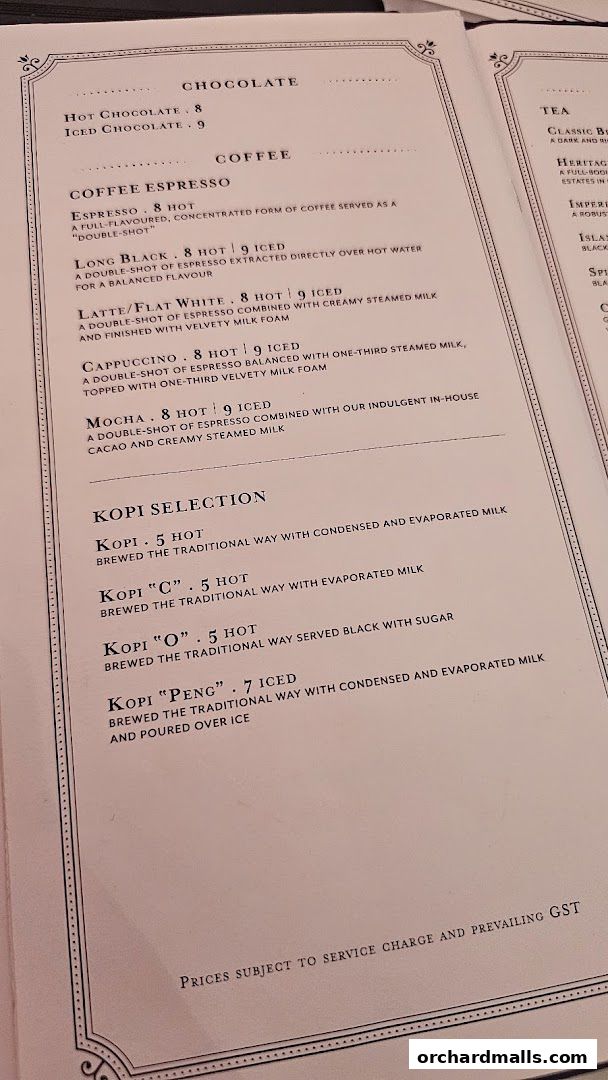 A menu featuring coffee, chocolate, tea, and kopi selections with prices.
