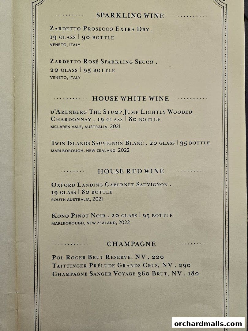A menu featuring sparkling wine, house white wine, house red wine, and champagne.
