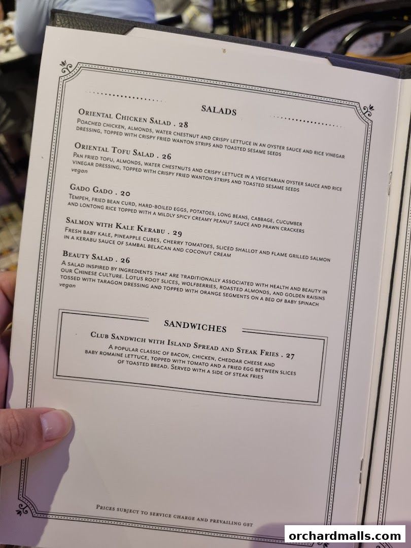 A menu featuring salads and sandwiches with detailed descriptions and prices.