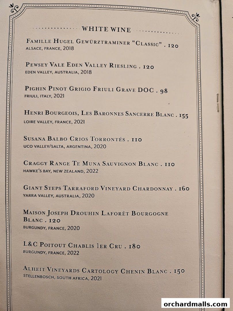 A menu featuring a selection of white wines with their origins and prices.