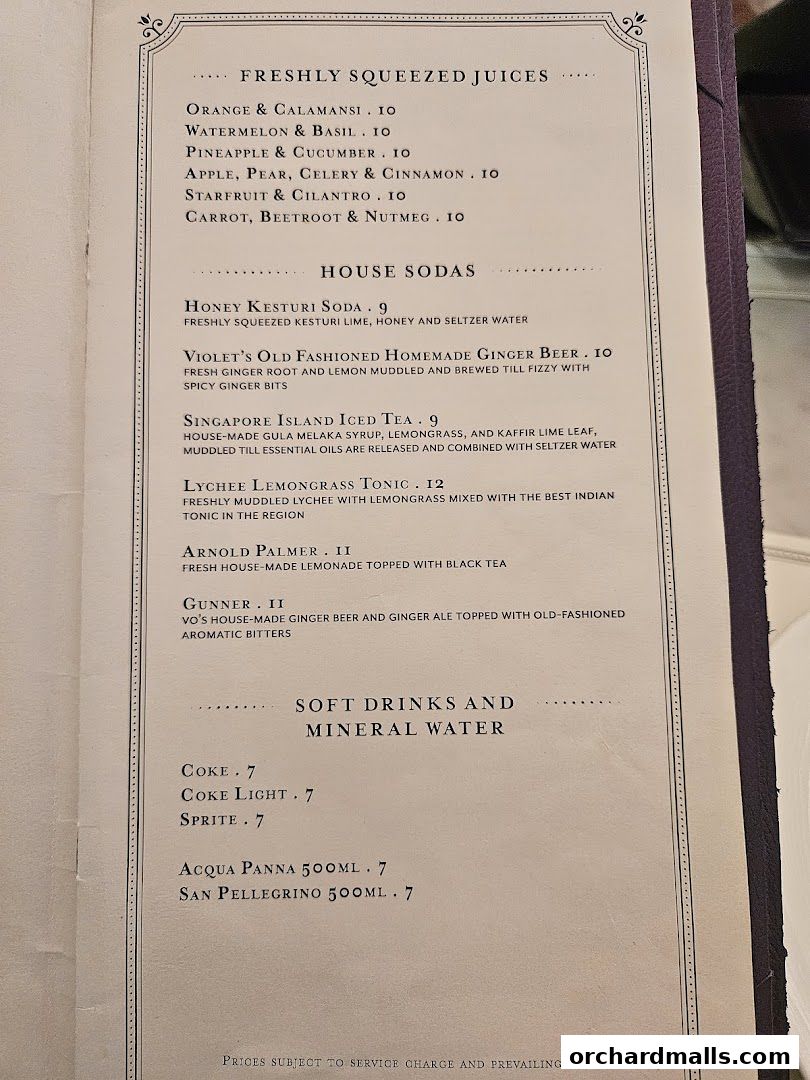 A menu featuring freshly squeezed juices, house sodas, and soft drinks.