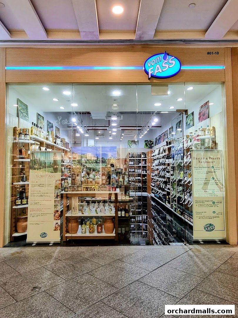 The storefront of Vom Fass ION, showcasing a wide selection of oils, vinegars, and spirits.