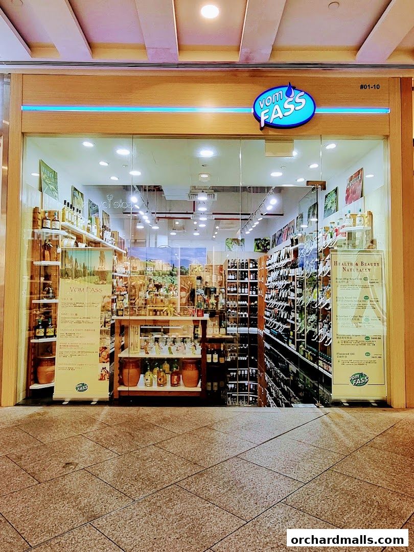 The exterior of a Vom Fass shop, showcasing a wide selection of oils, vinegars, and spirits.