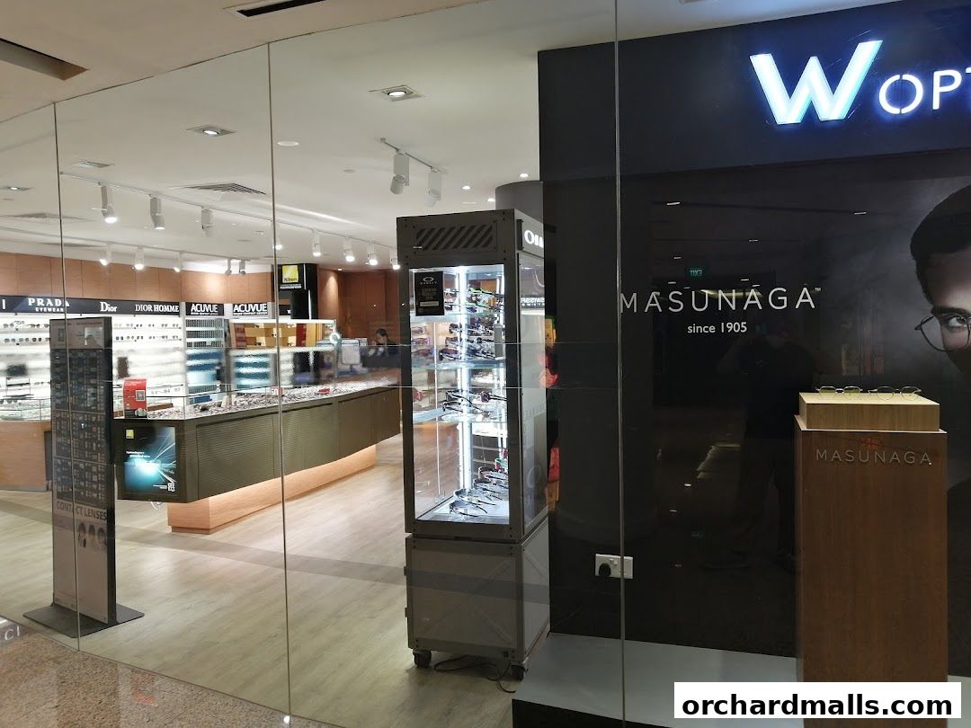 Interior view of W Optics eyewear store showcasing various brands and display cases.