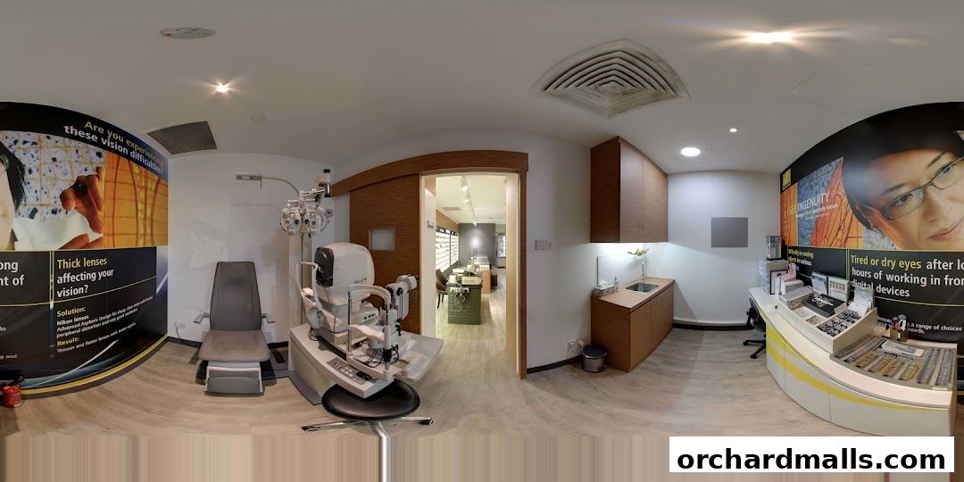 Interior of an optical shop with an eye examination chair and equipment.