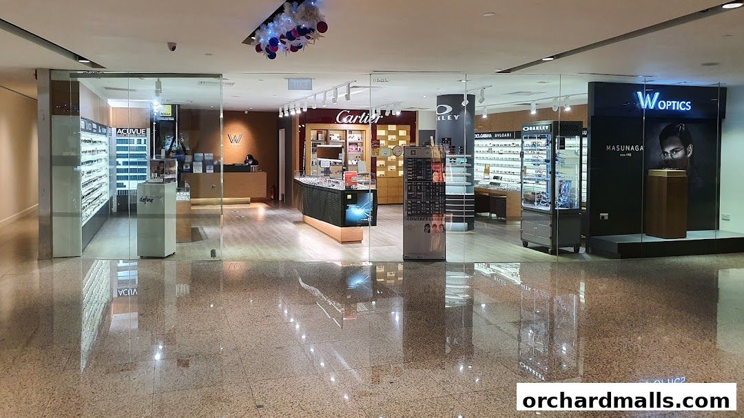 The exterior of W Optics, an eyewear store, showcasing various brands of glasses and contact lenses.