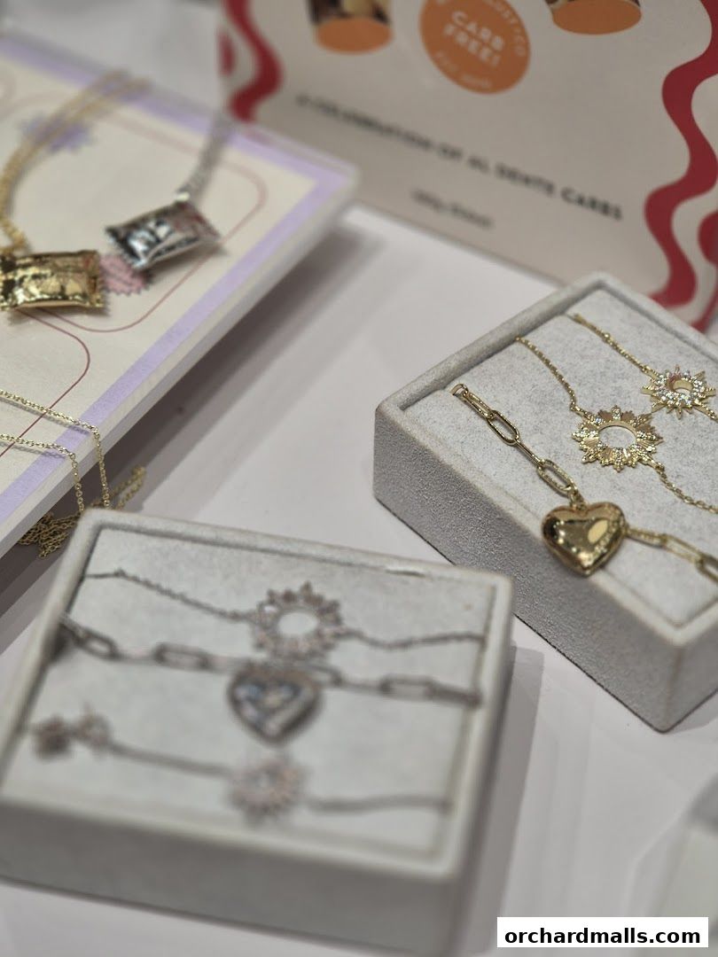 Close-up of elegant necklaces and bracelets displayed in boxes.