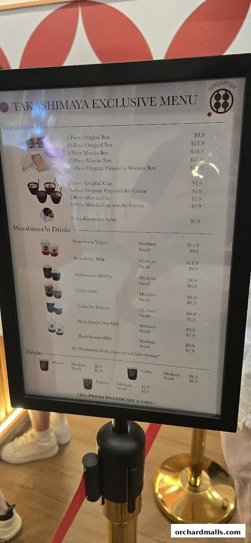 A menu board displaying Warabimochi boxes, cups, and drinks with prices.