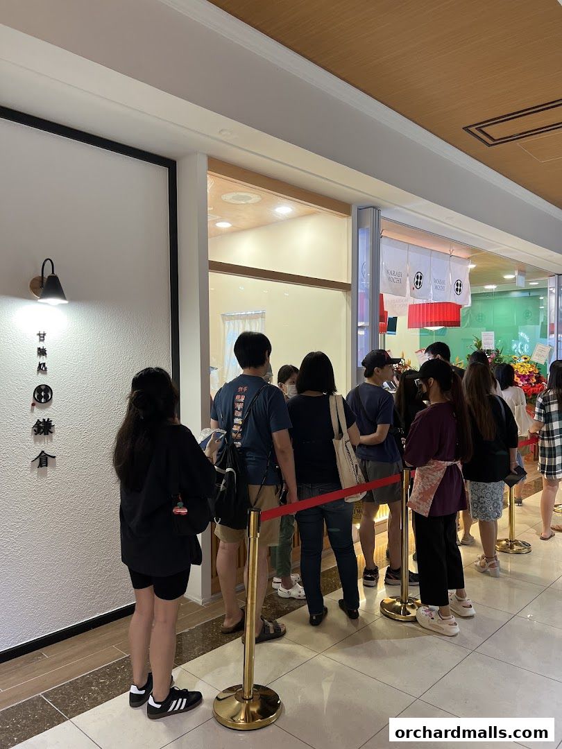 A line of customers waits outside the Warabimochi Kamakura shop.