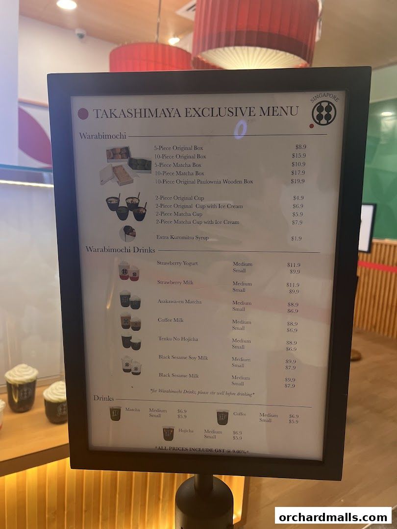 A menu board displaying Warabimochi, drinks, and prices at Warabimochi Kamakura.