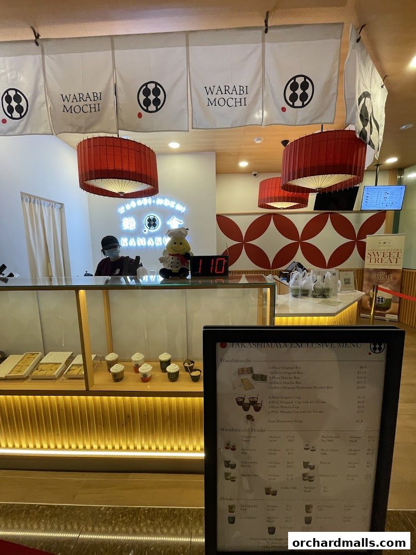 A menu board for Warabimochi Kamakura, showcasing mochi and drink options.