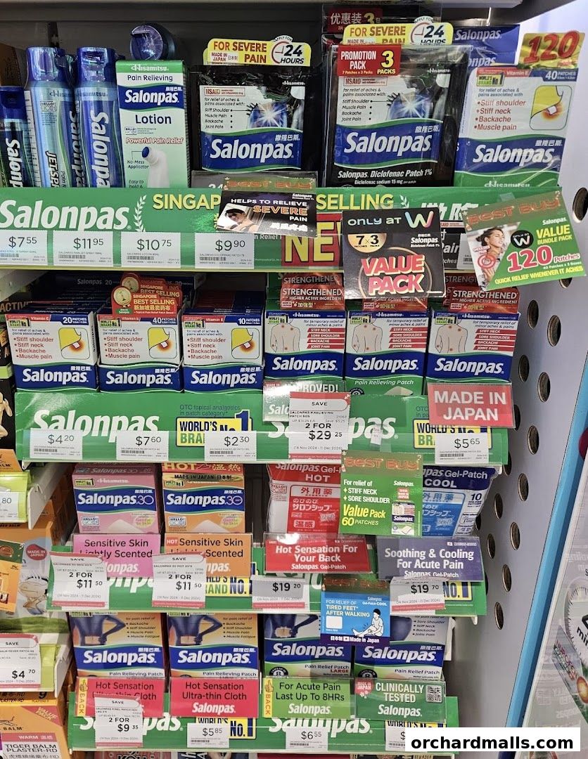 A display of various Salonpas pain relief patches and lotions in a retail store.
