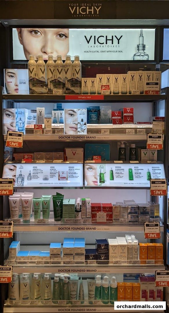 A display of Vichy skincare products, featuring various serums, moisturizers, and cleansers.