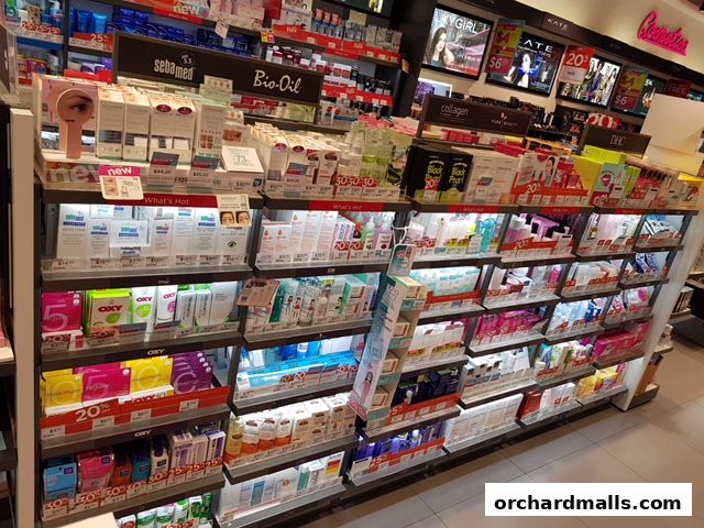 A wide selection of skincare and beauty products displayed on shelves in a retail store.
