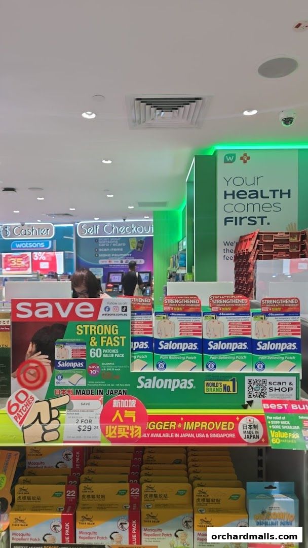 A display of Salonpas pain relief patches and Tiger Balm mosquito repellent patches at Watsons.