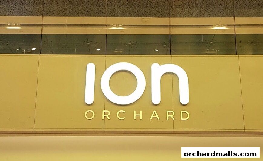 A close-up shot of the illuminated 'ION ORCHARD' signage.