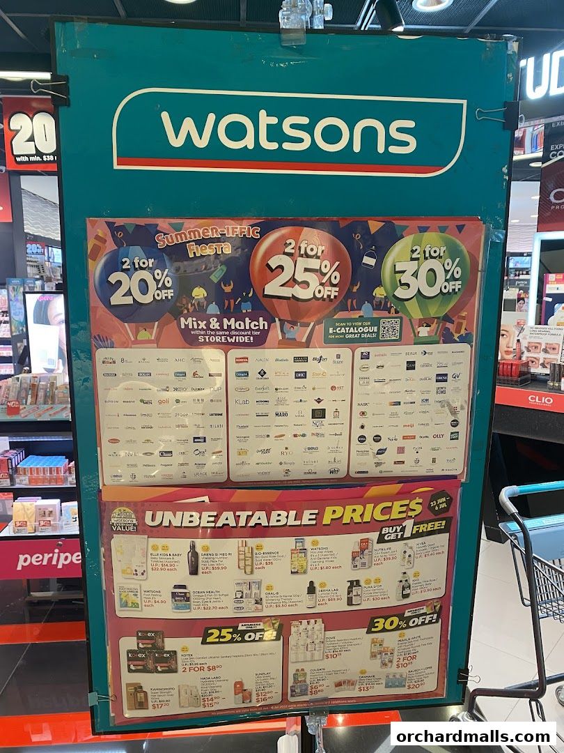A Watsons store display featuring summer promotions and discounts on various products.