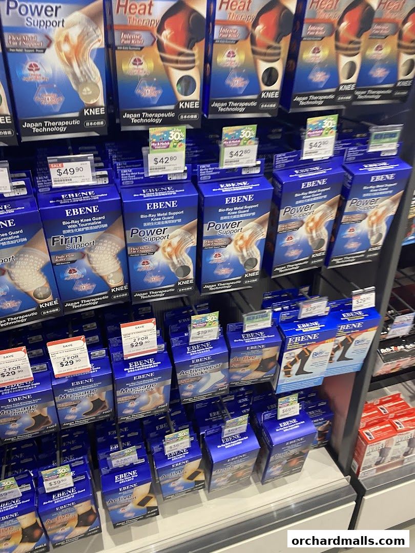 Shelves stocked with various knee support and therapy products from EBENE.