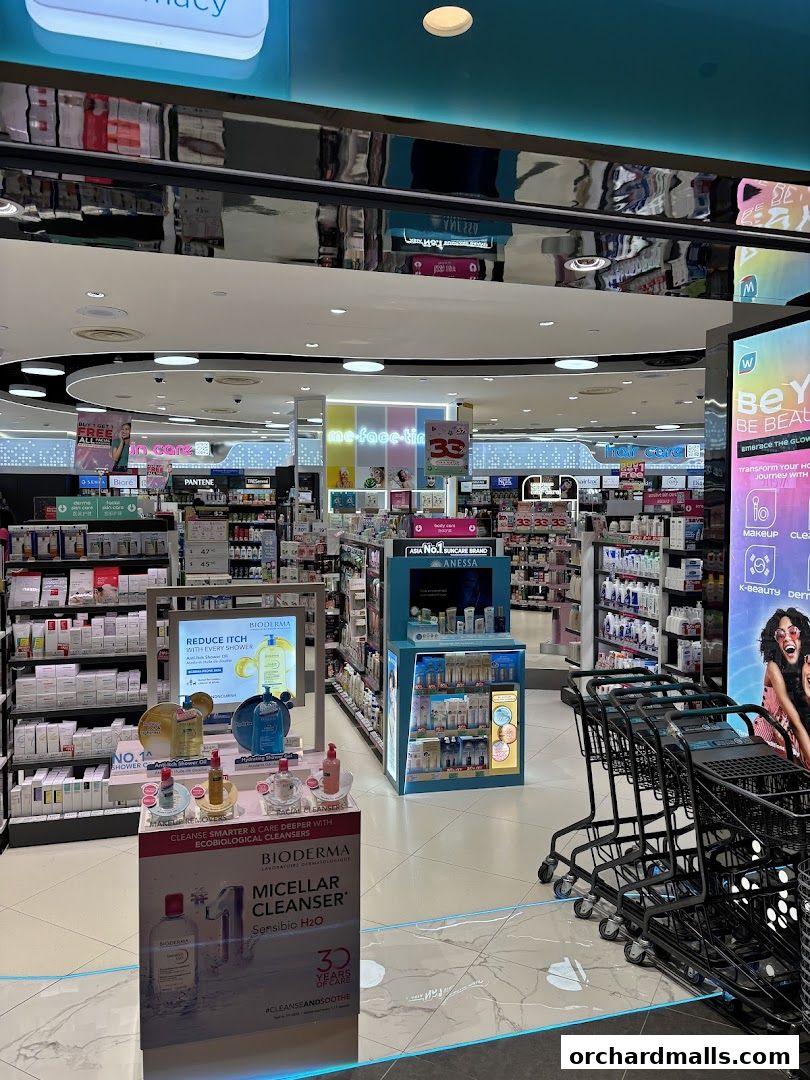 Interior view of a Watsons pharmacy and beauty store with shelves of products and shopping carts.
