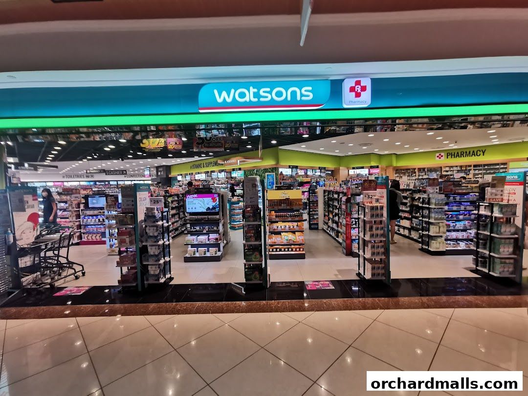 The entrance of a Watsons pharmacy and health store, showcasing various products and displays.