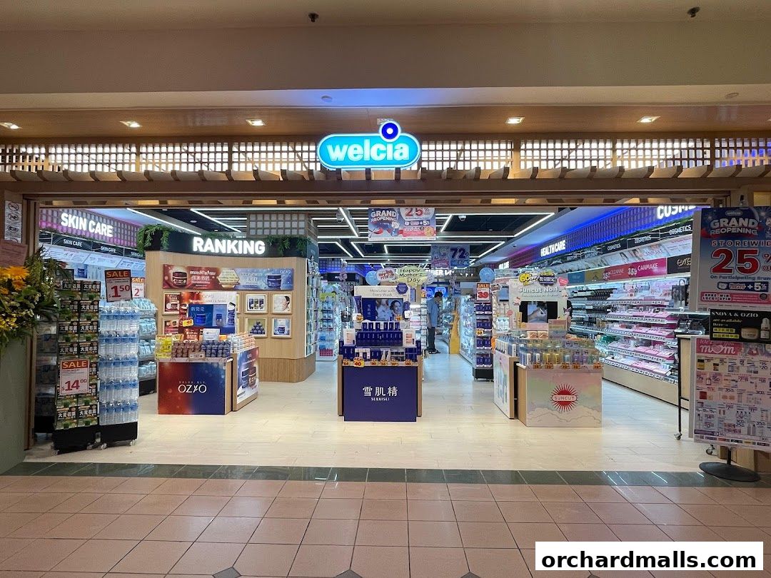The entrance of Welcia, a beauty and health store, showcasing various products and promotions.