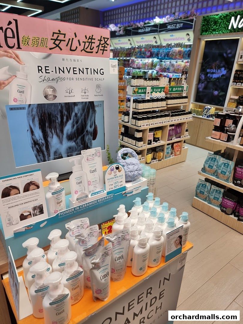 A display of Curél shampoo and conditioner products for sensitive scalps.