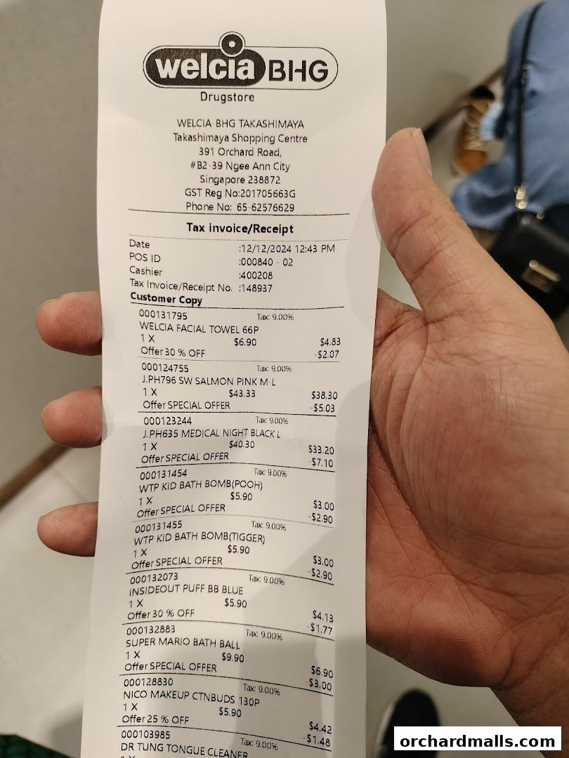 A receipt from Welcia BHG Drugstore showing various purchased items and their prices.