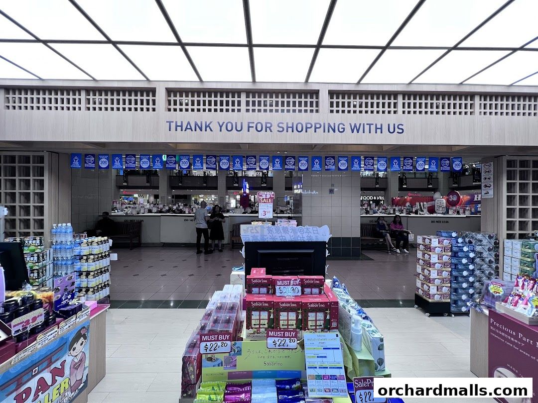 A retail shop entrance with products displayed and a 'Thank You' banner overhead.