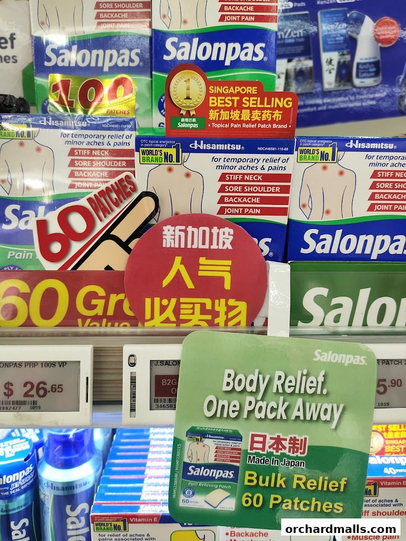 A display of Salonpas pain relief patches with various promotions and product information.