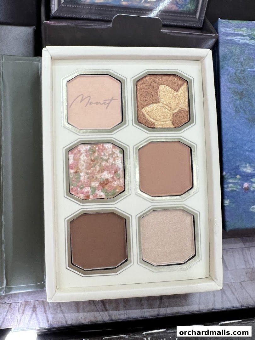 A makeup palette with six shades, featuring a floral design and the name 'Monet'.