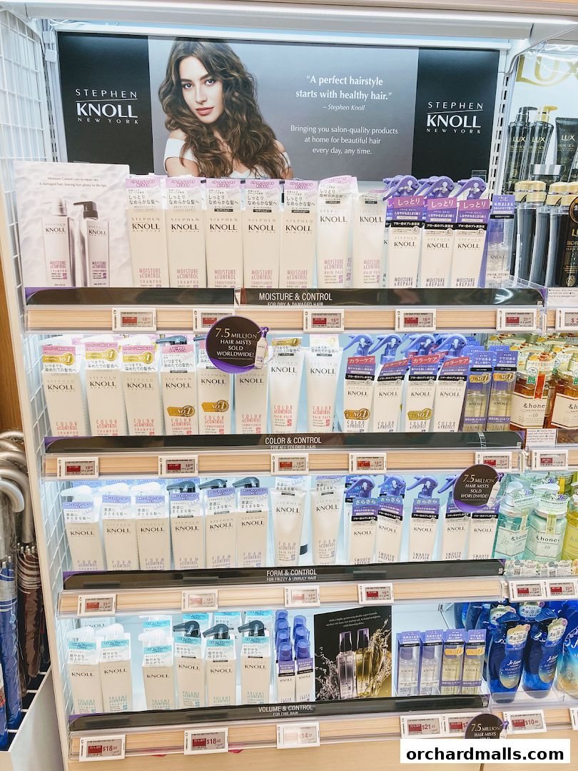 Display shelves filled with Stephen Knoll hair care products, including shampoos and conditioners.
